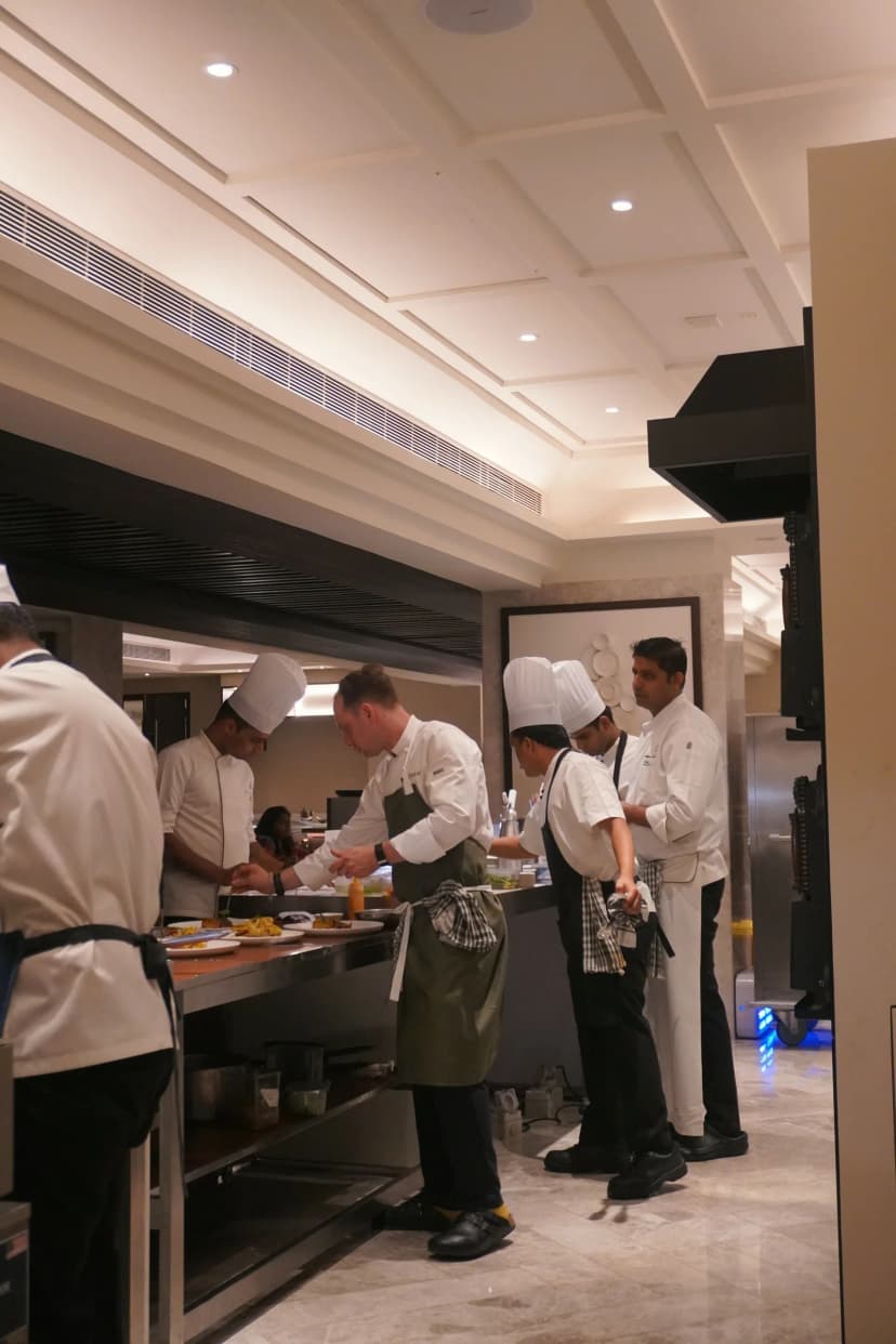 The kitchen team working along the pass in Hyderabad