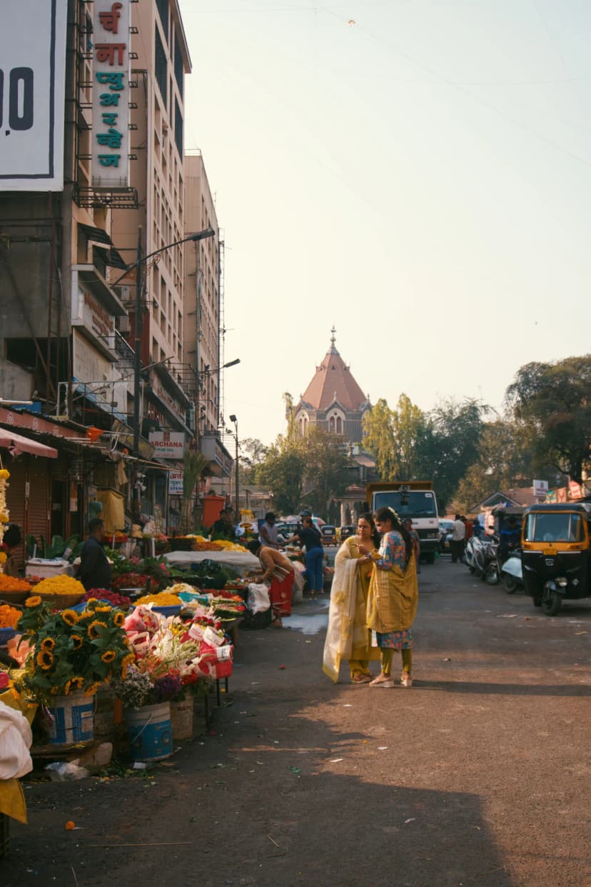 Flower and produce stalls along a street in Pune