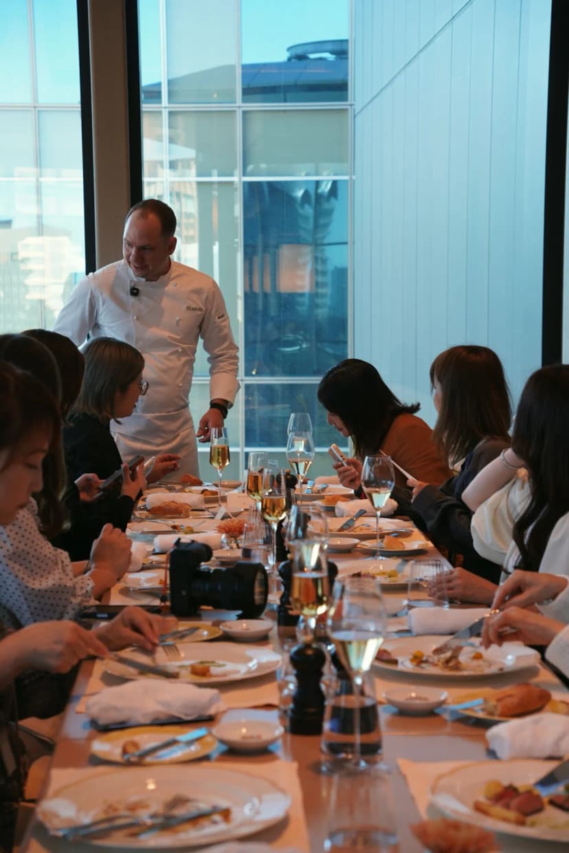 Jason serving the long table at the Jolie press lunch